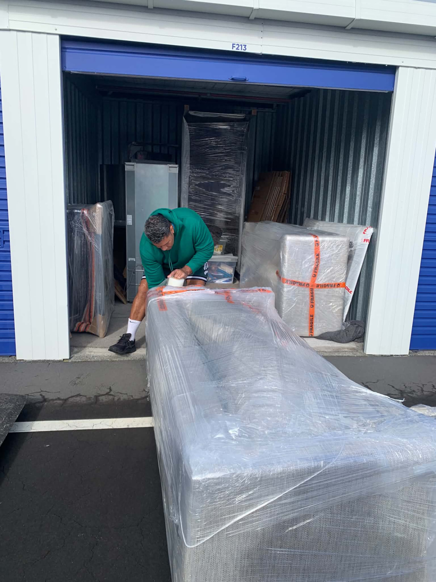 Team member carefully wrapping furniture for a move